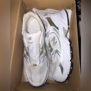 New Balance White and Gold Athletic Shoes